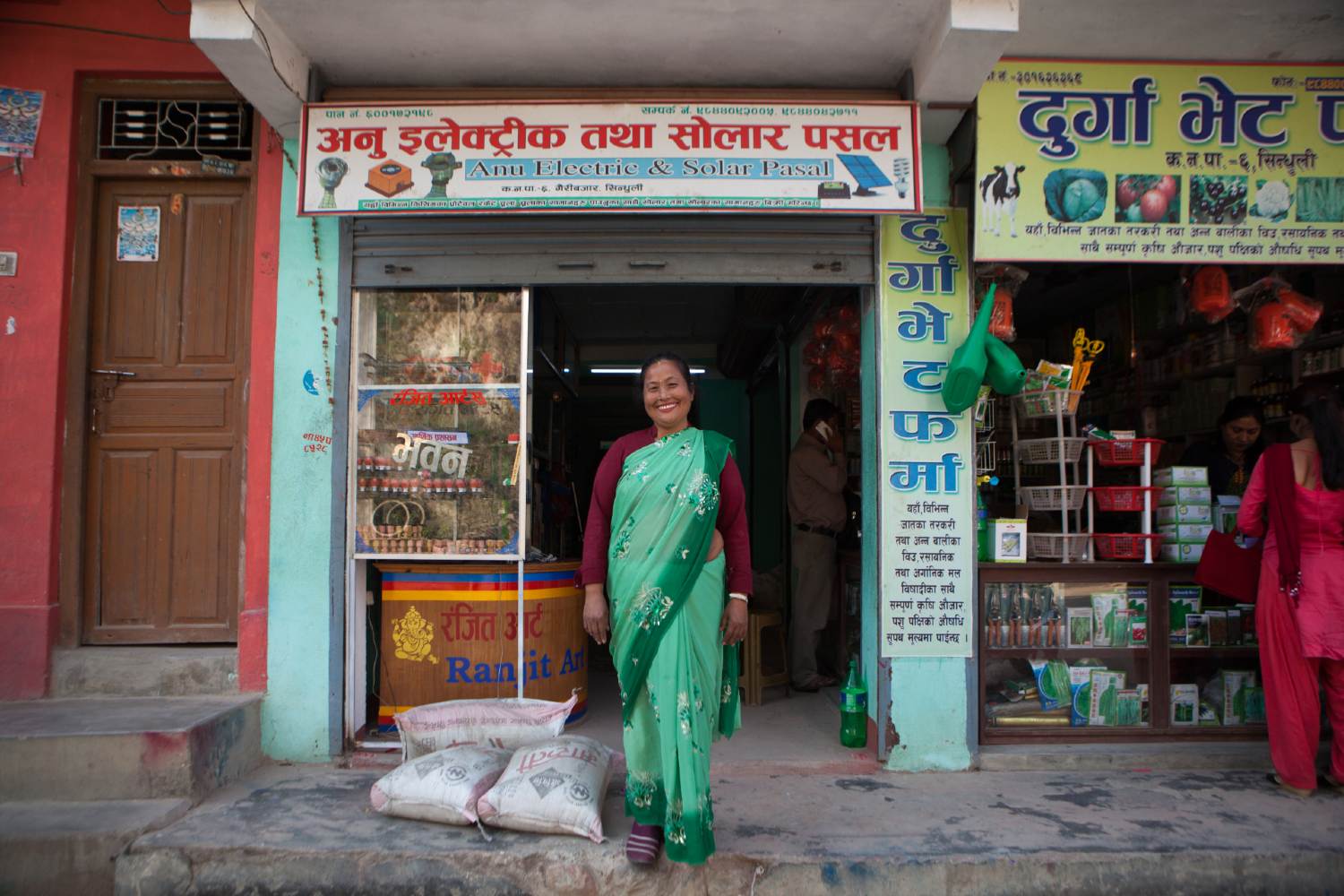 Niru in front of her green energy technology business